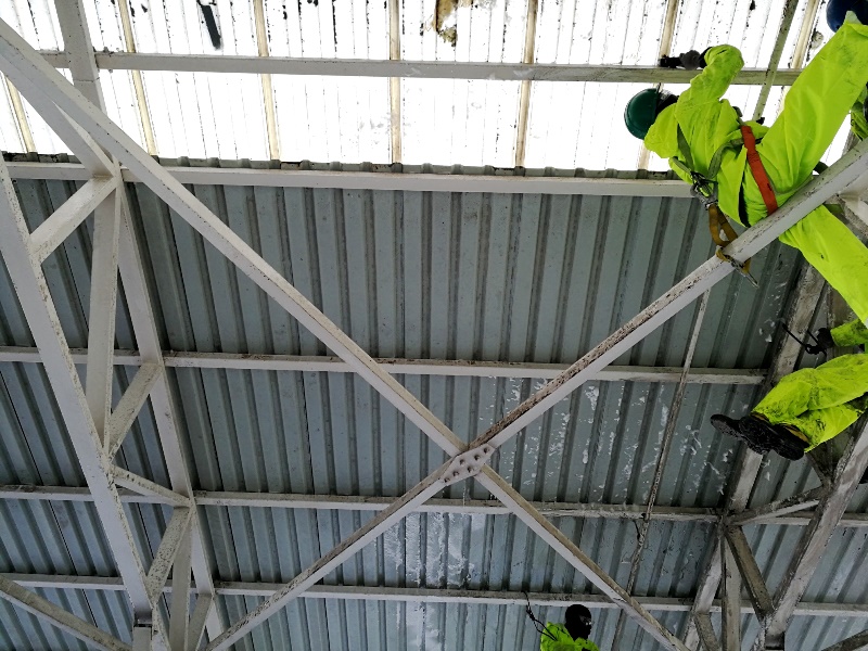 Cleaning a roof structure at height