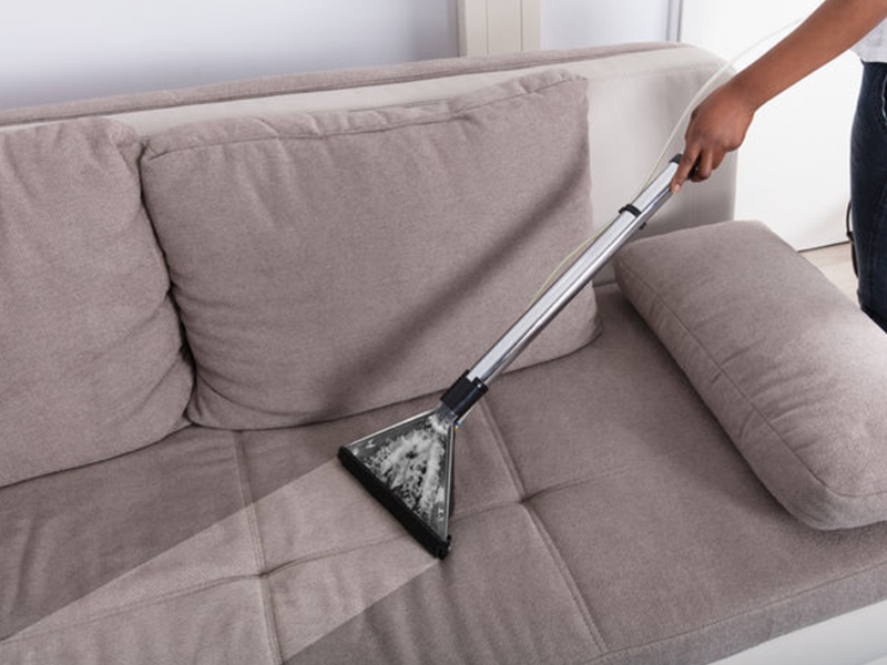 Cleaning the upholstery of a sofa